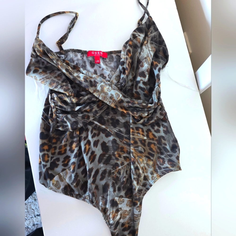 Nearly new Guess tank body suit Animal print size Large